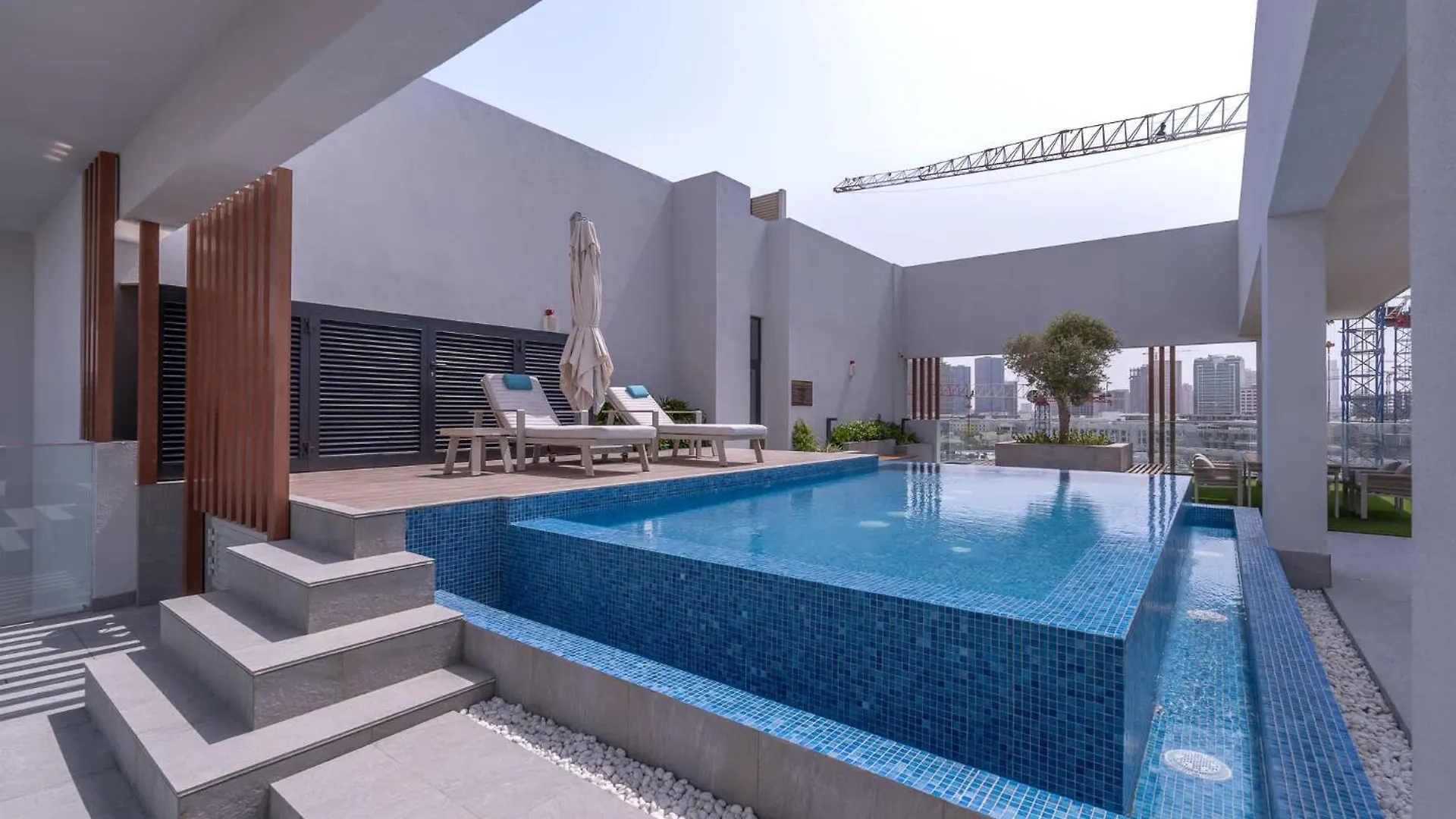 Minimalist Studio With Nature-Inspired Balcony In Jvc Dubai Apartment