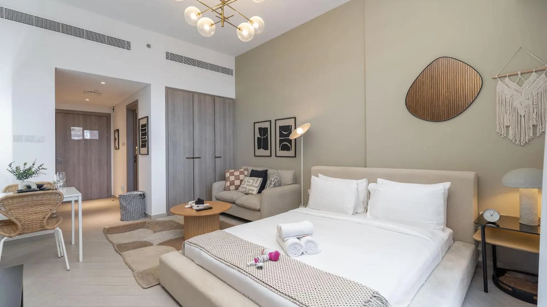 Minimalist Studio With Nature-Inspired Balcony In Jvc Dubai Apartment